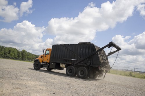 Crew loading a van with commercial waste from a shop clearance